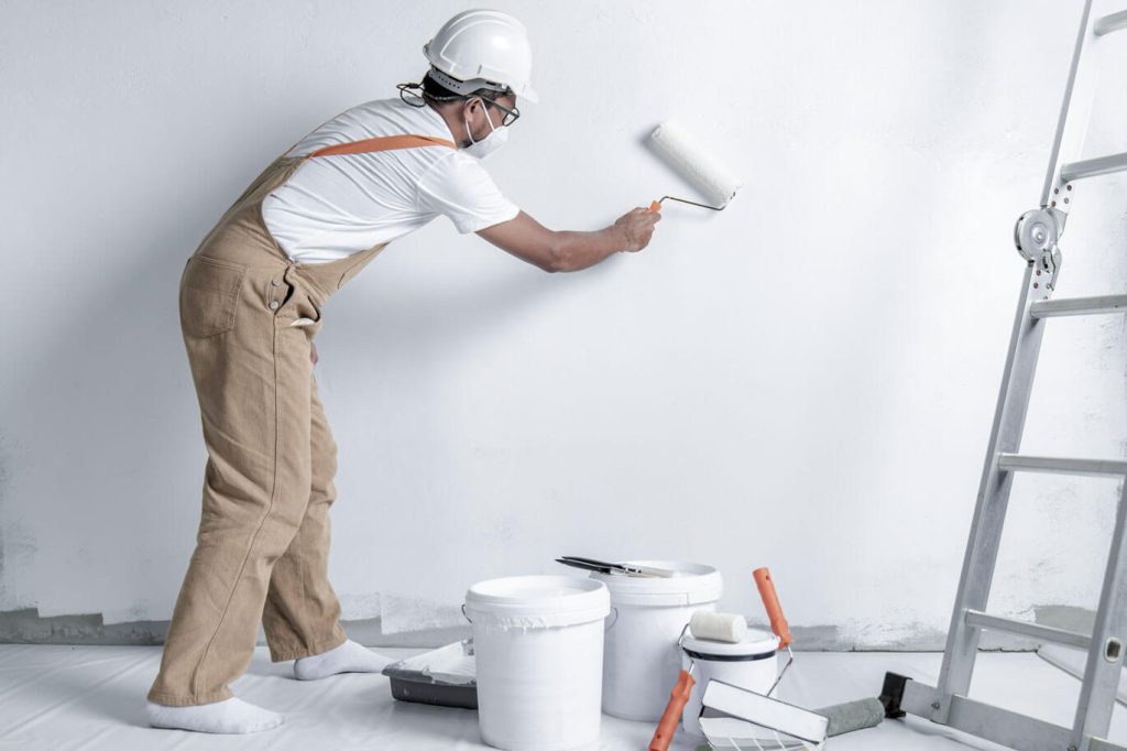 Man painting wall